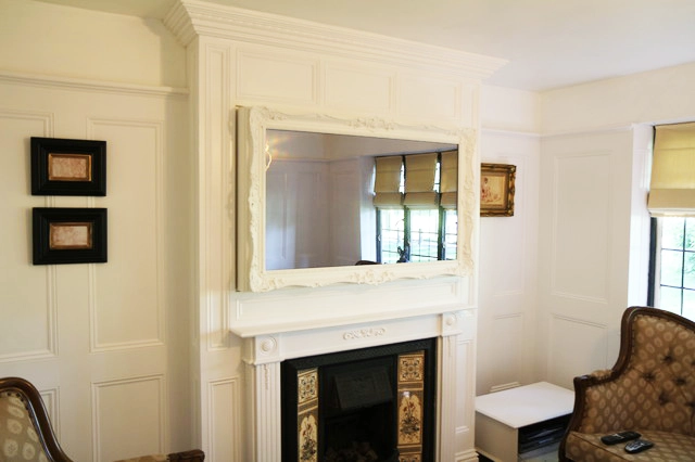 From Clutter to Class: A TV Mirror Transformation 8 White living room interior decor with a TV after installing the Mirror TV Frame over it, seamlesly integrating the TV into decor.